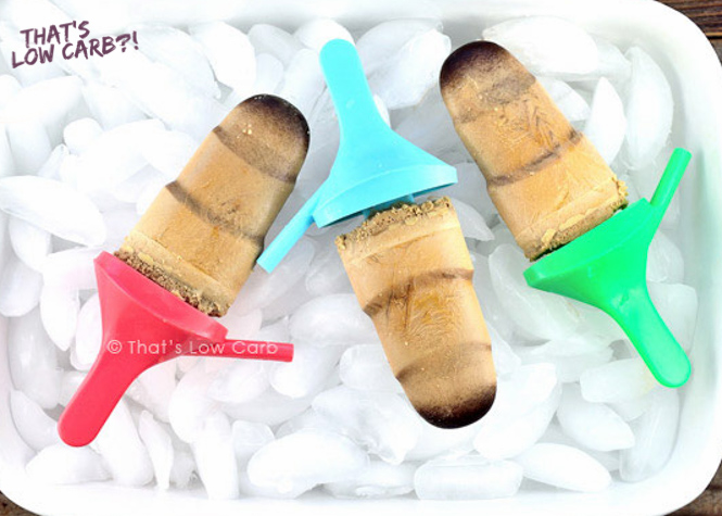 Image of three Keto Coffee Popsicle on ice with multi colored handles.