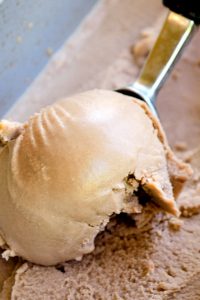 Image of Keto Chocolate Ice Cream being scooped out of pan.