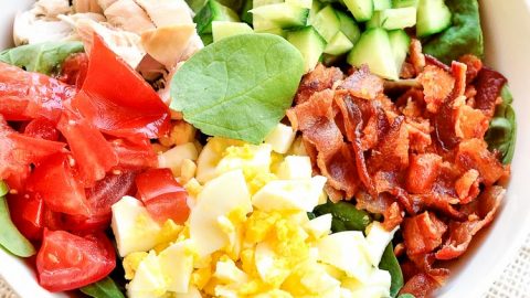 Close up shot of low carb keto cobb salad ingredients in a bowl unmixed.
