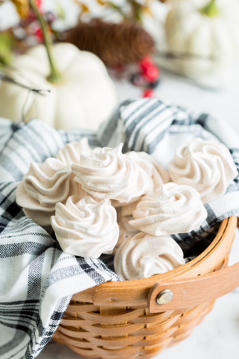 Pumpkin Spice Meringues stacked on top of eachother in basket