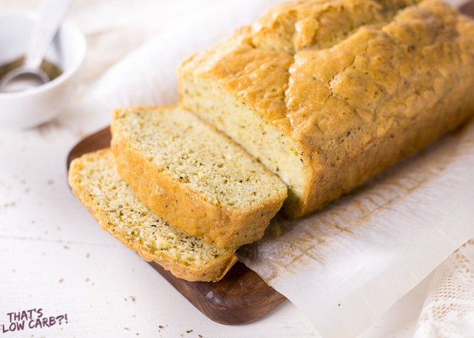 Low Carb Rosemary Bread loaf next to a couple slices.