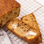 Slices of Keto Zucchini Bread with Butter on Cooling Rack