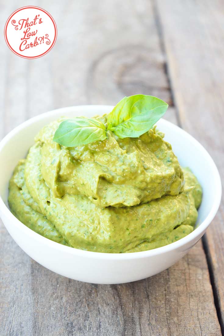 Low Carb Avocado Pesto Sauce piled up in a small white bowl, ready to use.