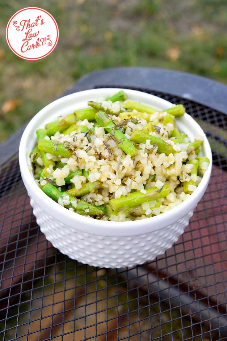 Low carb cauli-rice asparagus salad with tarragon dressing recipe in a white bowl, ready to serve and enjoy.
