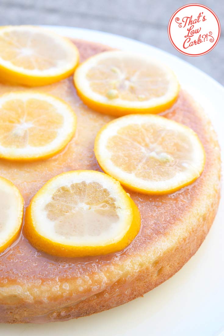 And up close view of this low carb lemon cake shows the entire, uncut cake with lemon slices arranged in a circle around the top of the cake.