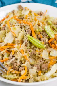 Low Carb Egg Roll in a Bowl with shredded carrots, beef, onion, and cabbage.