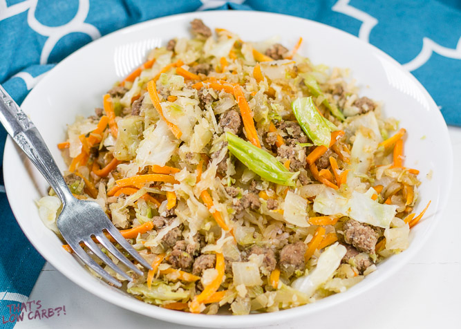 Low Carb Egg Roll in a Bowl with shredded carrots, beef, onion, and cabbage.