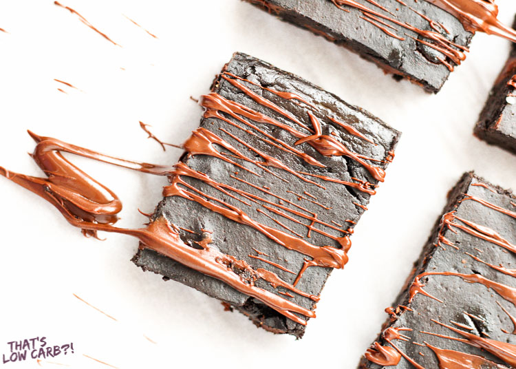 Image of Keto Low Carb Flourless Brownie square with chocolate drizzled over top.