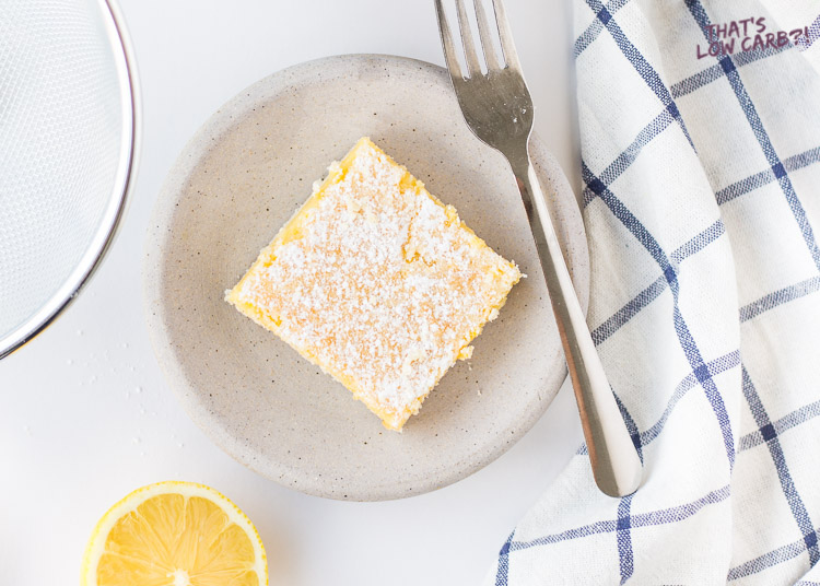 Overhead sho of Low Carb Keto Lemon Bar square with powder sugar on top.