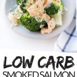 PINTEREST IMAGE with words "low carb smoked salmon cheese sauce" with image of Low Carb Smoked Salmon Cream Cheese Sauce over broccoli on a white plate.
