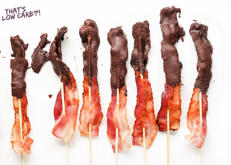 Image of Low Carb Chocolate Covered Bacon on skewers laying next to each other.