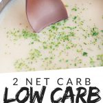 PINTEREST IMAGE with words "2 net carb low carb sausage gravy" with image of Low Carb Keto Sausage Gravy in a pot with spoon sticking out.