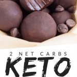 PINTEREST IMAGE with words "2 net carbs Keto Chocolate Fat Bombs" with image of Keto Chocolate Fat Bombs in a pile with the top one missing a bite.