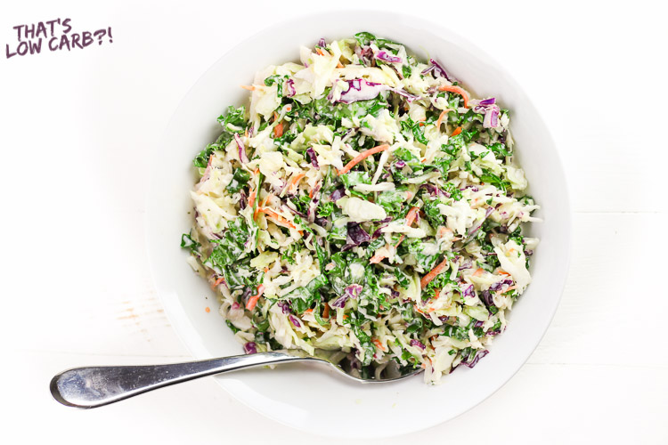 Image of Low Carb Keto Coleslaw in a white bowl with a silver spoon.