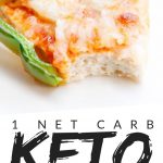 PINTEREST IMAGE with words "1 net carb keto chicken crust pizza" with image of keto chicken crust pizza slice with green pepper on top and a bite missing.