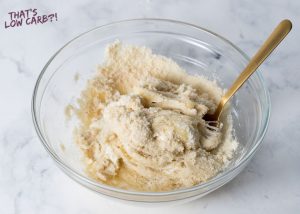 Image of keto Fathead dough ingredients being mixed together in a glass bowl.