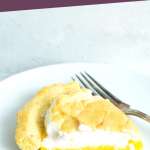 PINTEREST IMAGE with words "5 net carb low carb lemon meringue pie" with a slice of lemon meringue pie on a white plate with a fork laying beside.
