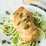 Chicken Piccata over zooodles on white plate
