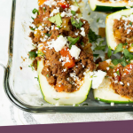 Zucchini with meat and cheese on top in a casserole dish