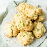 Cheddar Bay Biscuits piled on a cutting board