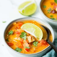 Chicken Taco Soup in a bowl with a spoon full being scooped